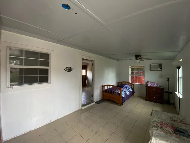 a bedroom with furniture and window
