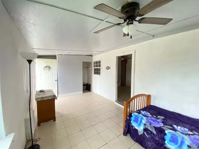 a kitchen with a refrigerator and a sink