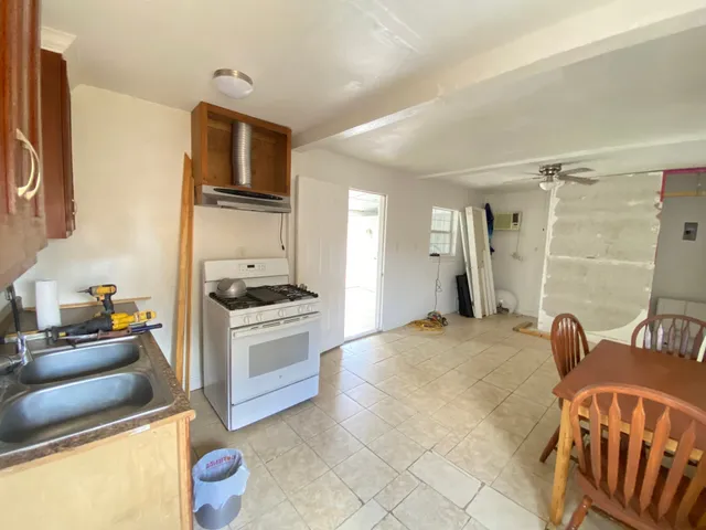 a view of a terrace with a garden and entertaining space