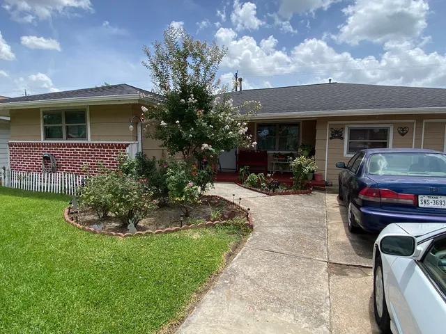 a house view with a garden space