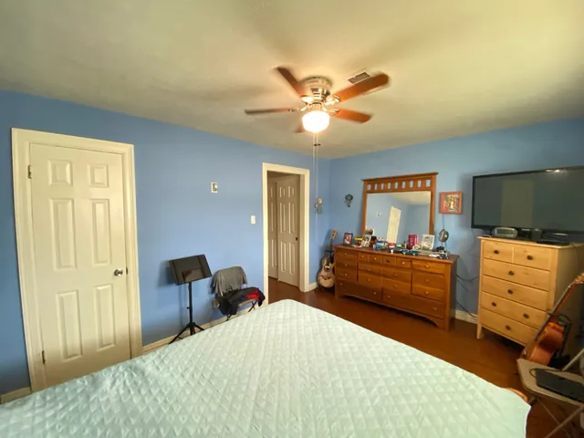 a bedroom with a bed and furniture