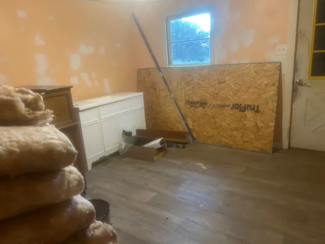 a view of balcony with wooden floor