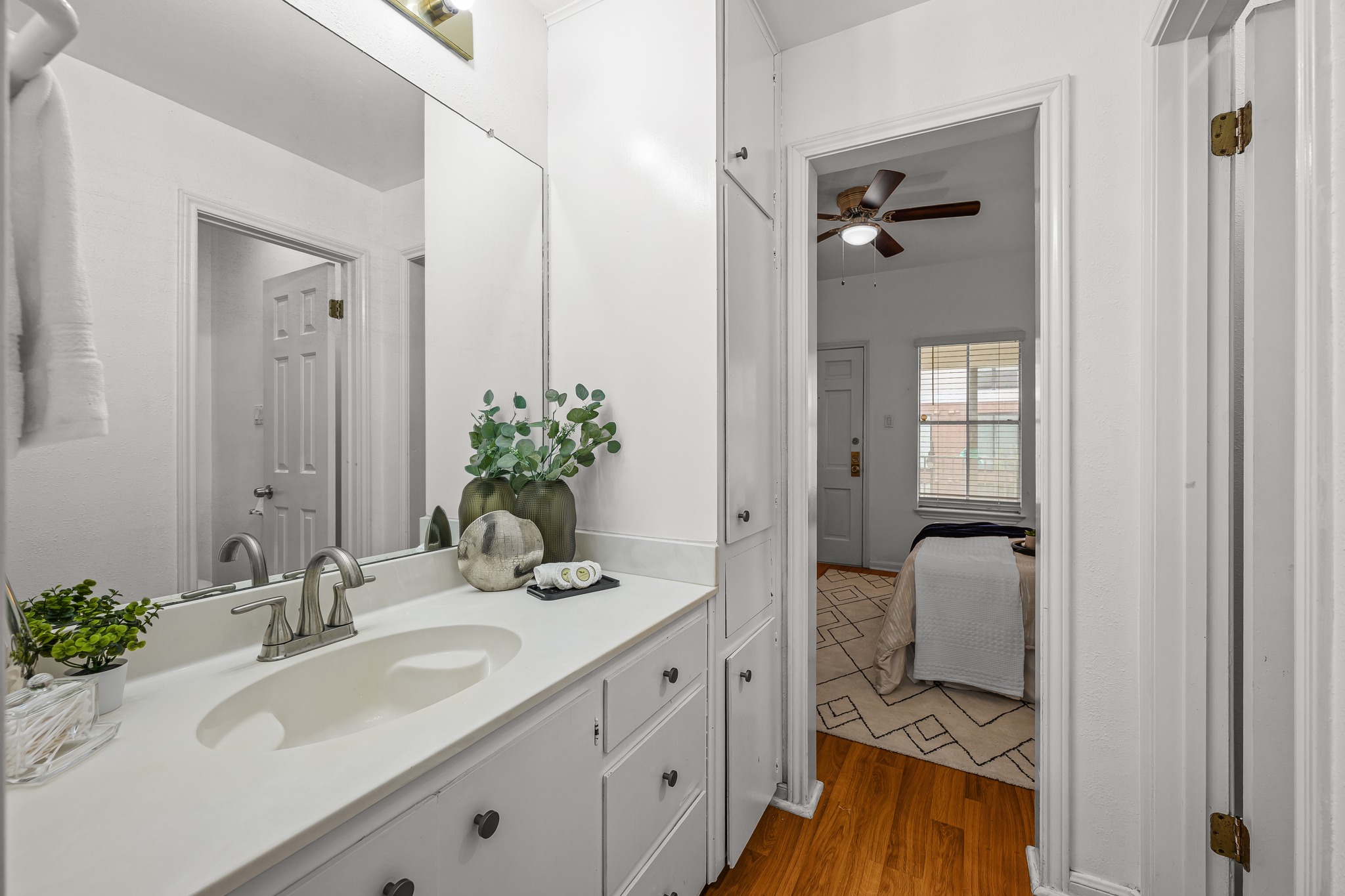 2529 Rio Grande Street, Unit 12 Austin, TX 78705 - Photo 19 of 24 a bathroom with a granite countertop sink and a mirror