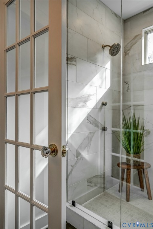 4312 Cary Street Road Richmond, VA 23221 - Photo 51 of 75 a bathroom with a glass shower door