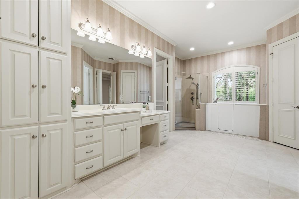 970 Crystal Cove Oak Point, TX 75068 - Photo 21 of 40 a large bathroom with a mirror a double vanity sink and a mirror