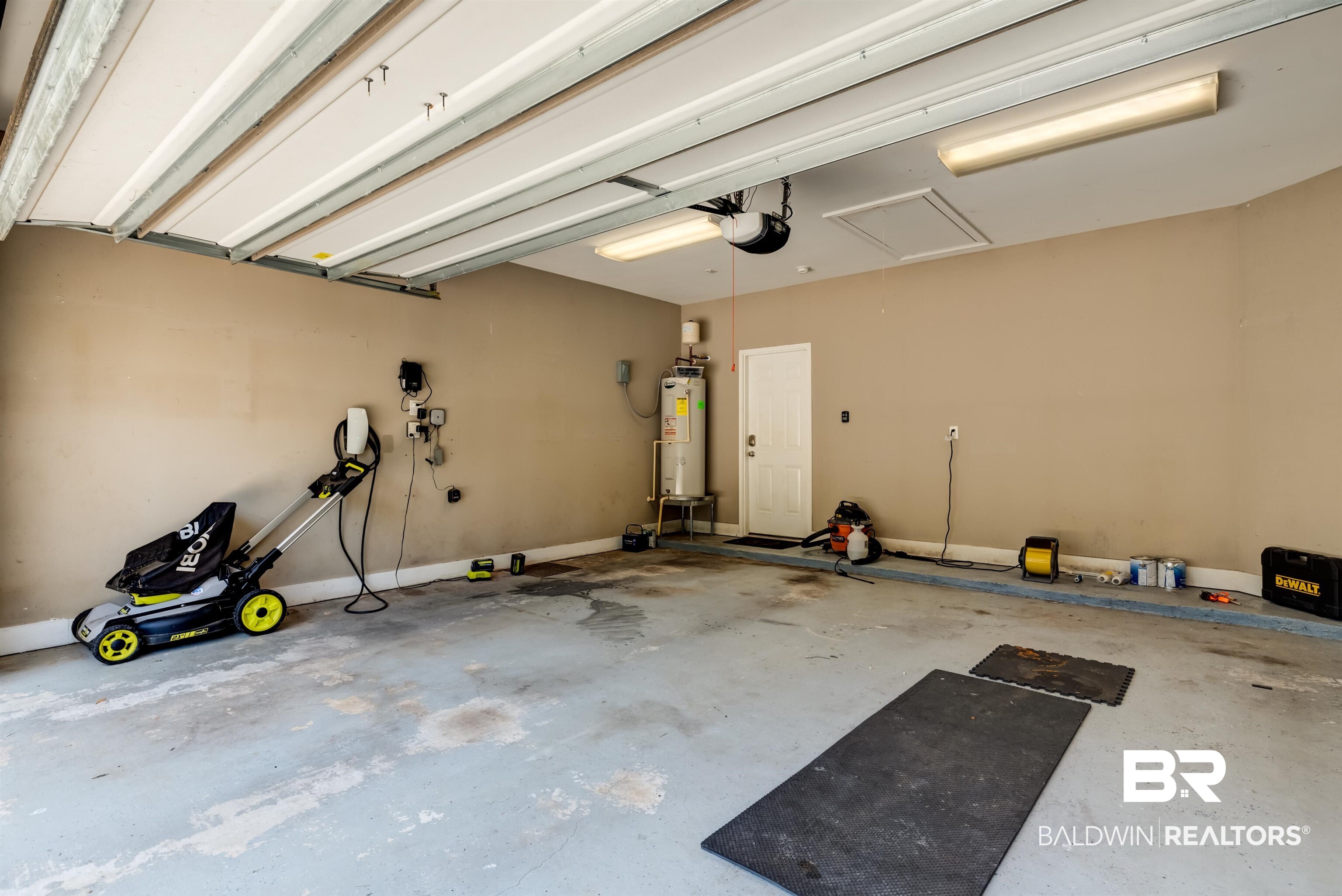 965 Henckley Avenue Mobile, AL 36609 - Photo 24 of 30 Garage with a garage door opener and water heater
