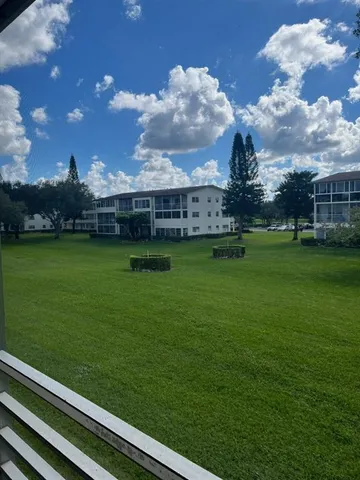 a view of a big yard next to a building
