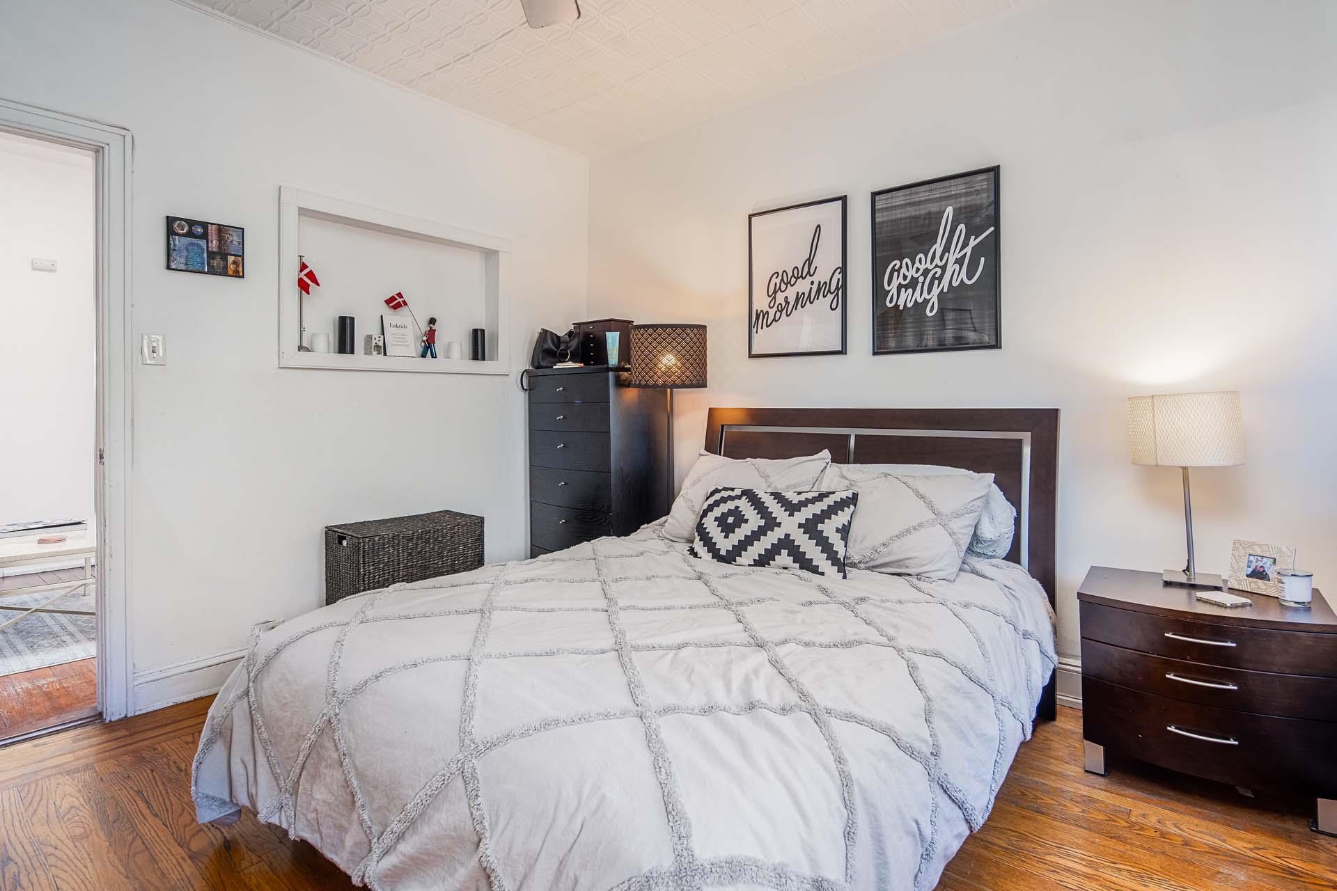 710 Bloomfield Street, Unit 3 Hoboken, NJ 07030 - Photo 8 of 13 a bedroom with a bed and wooden floor
