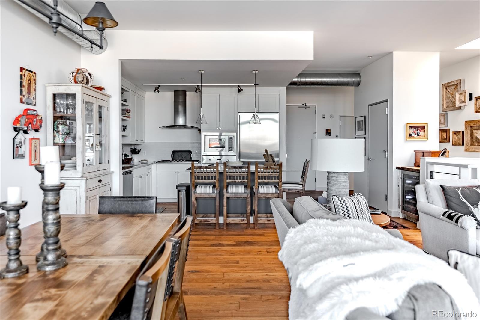 2229 Blake Street, Unit 709 Denver, CO 80205 - Photo 16 of 40 a living room with furniture and a flat screen tv
