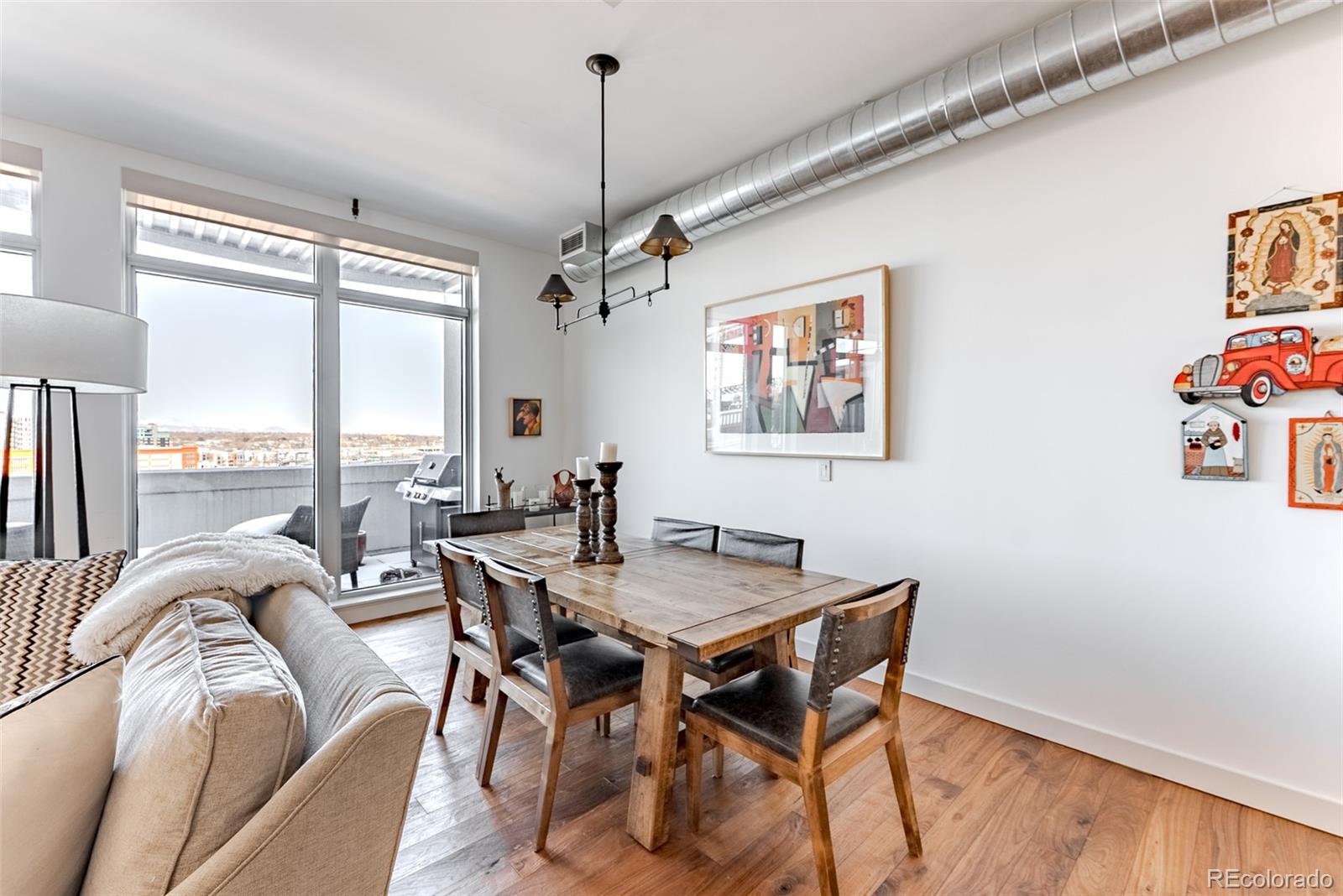 2229 Blake Street, Unit 709 Denver, CO 80205 - Photo 18 of 40 a view of a dining room with furniture window and outside view