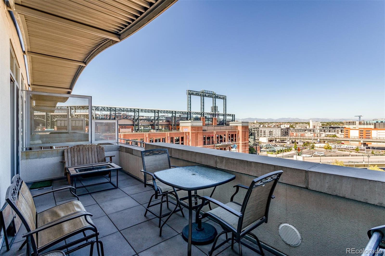 2229 Blake Street, Unit 709 Denver, CO 80205 - Photo 19 of 40 a view of a chairs and table in patio
