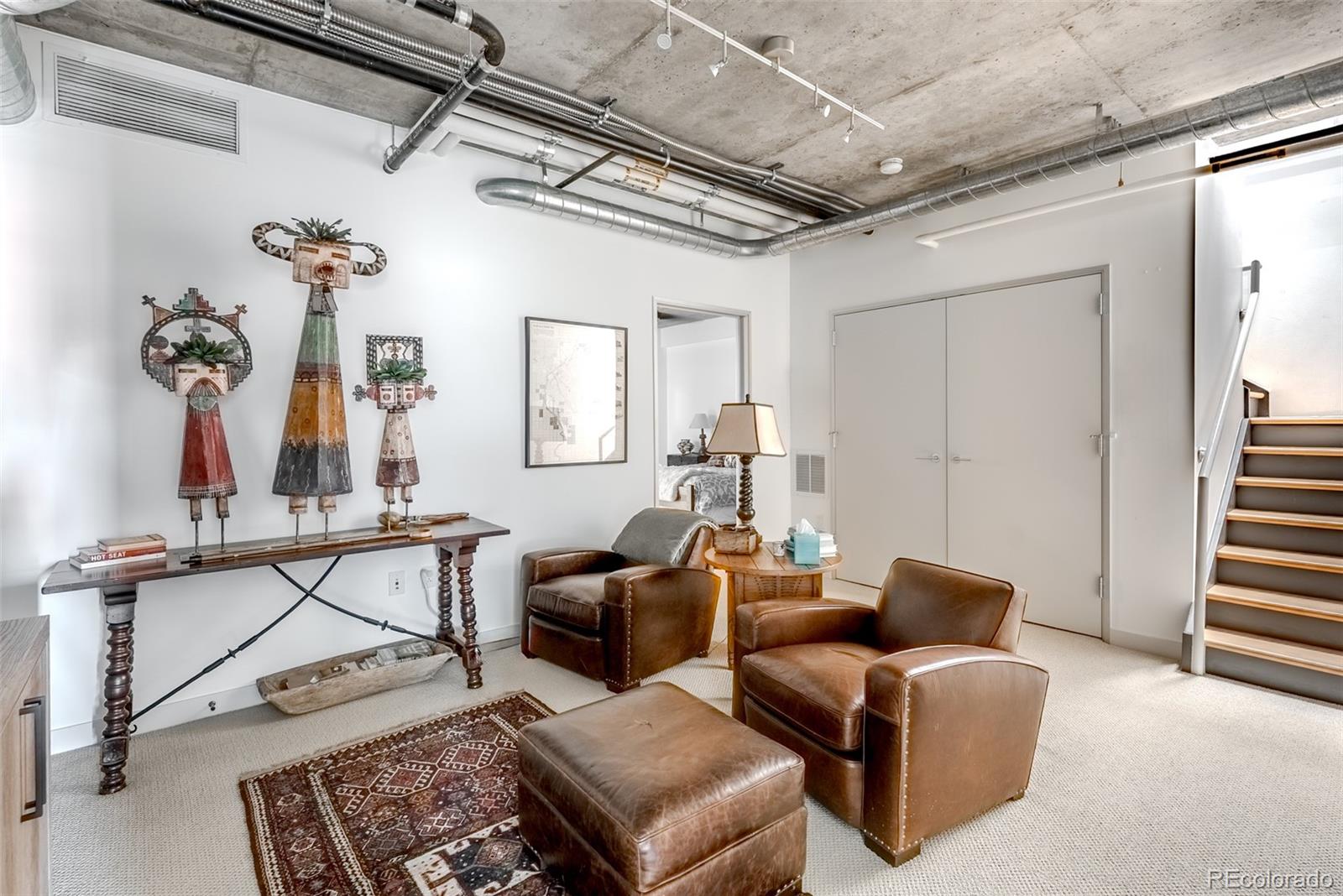 2229 Blake Street, Unit 709 Denver, CO 80205 - Photo 22 of 40 a living room with furniture