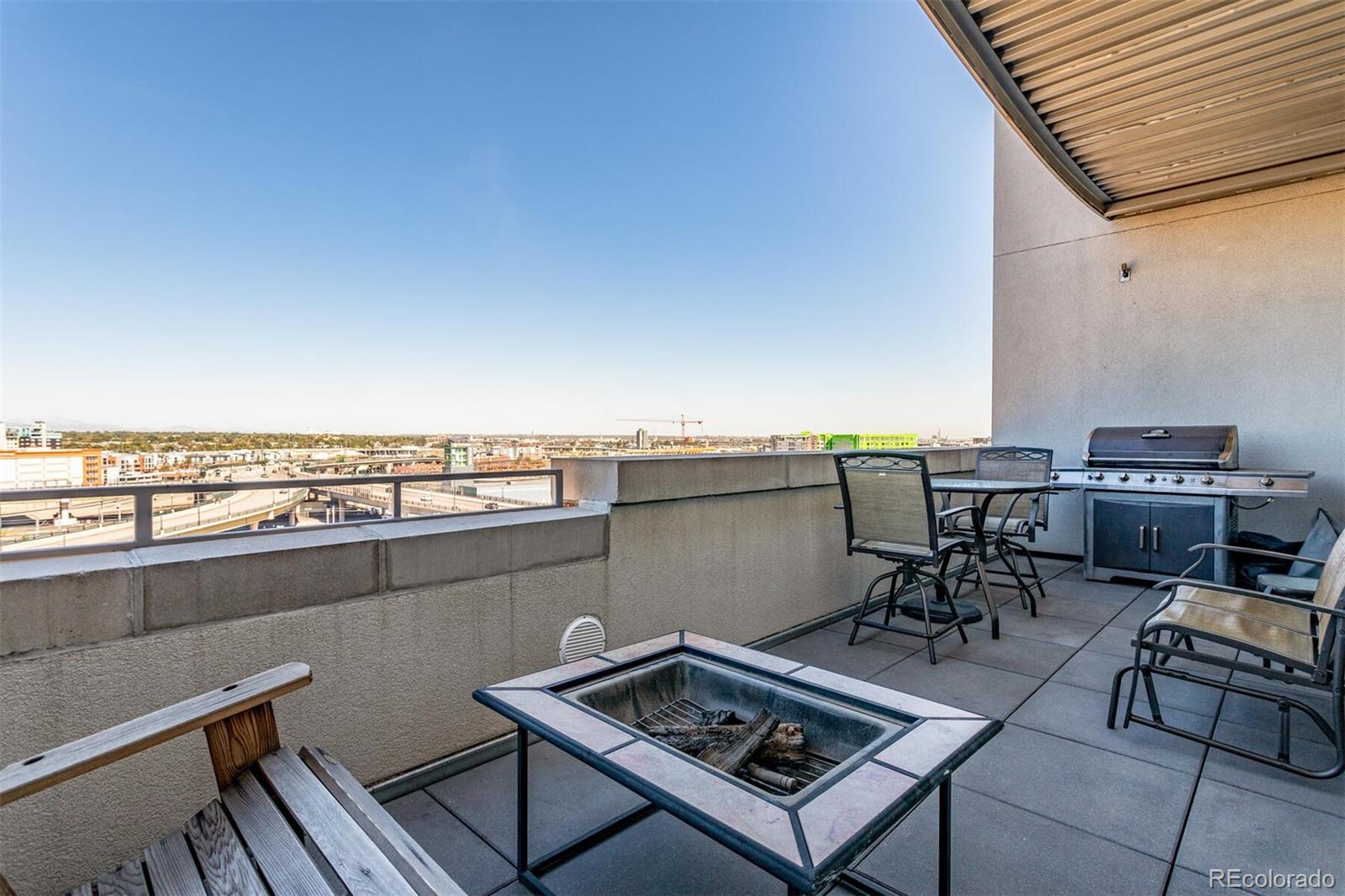 2229 Blake Street, Unit 709 Denver, CO 80205 - Photo 31 of 40 a view of a terrace with furniture