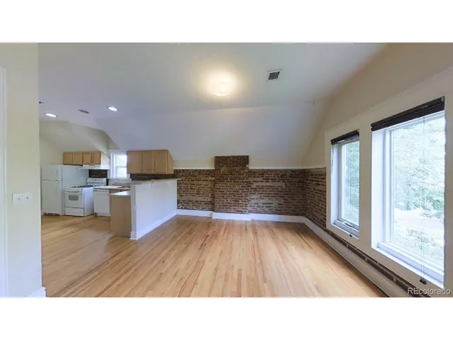 a upper view of a living room kitchen and a sink