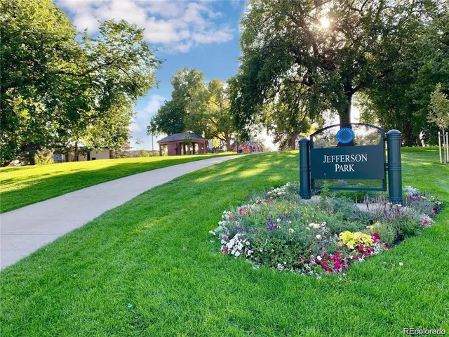 a view of a park that has large trees