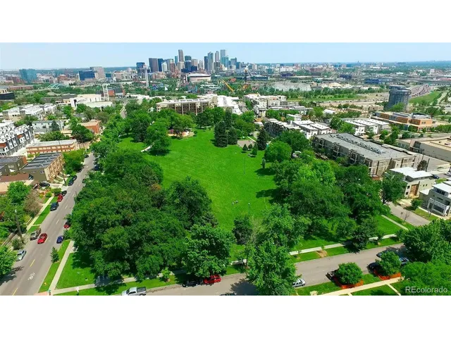 a view of city with tall buildings