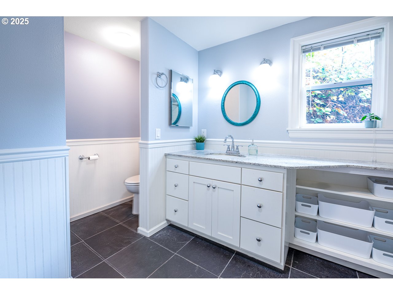 2575 Chula Vista Boulevard Eugene, OR 97403 - Photo 29 of 40 a en suite bathroom with a double vanity sink a mirror and a window