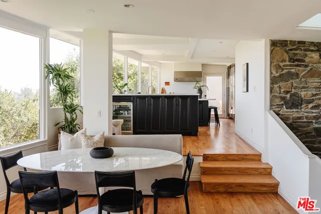 a kitchen with a sink stove and wooden cabinets