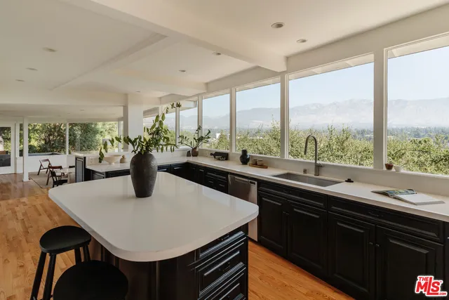 a view of a terrace with furniture and garden