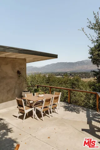 a bedroom with a large bed and a large window