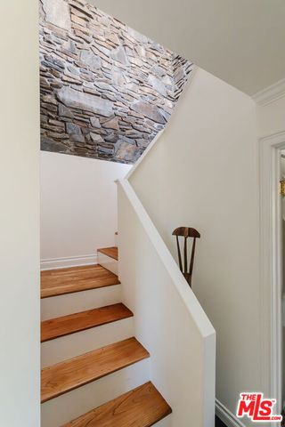 a bedroom with a bed and a mirror