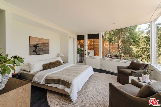 a bathroom with a bathtub and windows