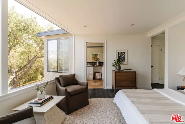 a room with chair and wooden floor