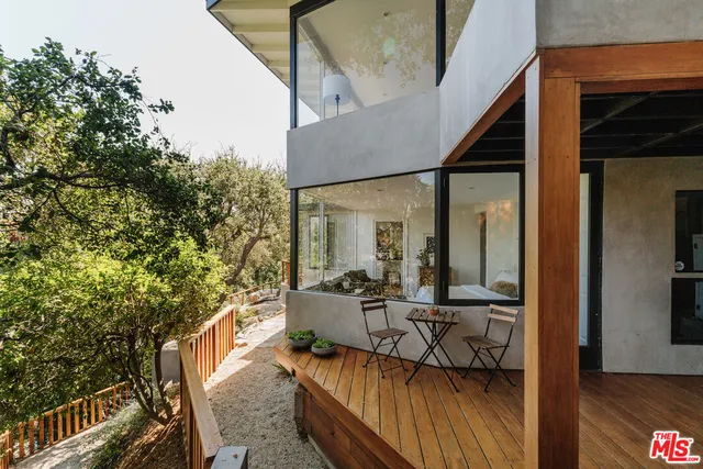 a bedroom with a bed and dresser