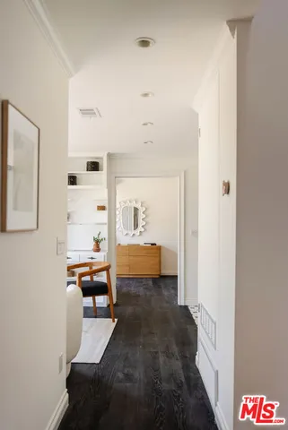 a view of a room with wooden floor and closet