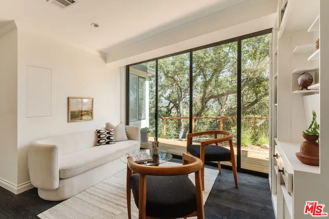 a view of house with backyard space and sitting area