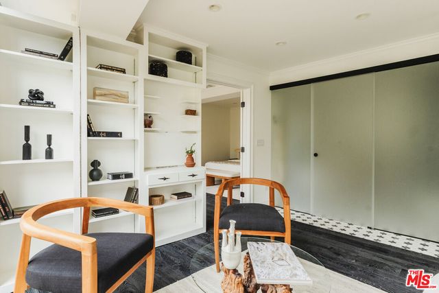 a view of a house with patio and a garden