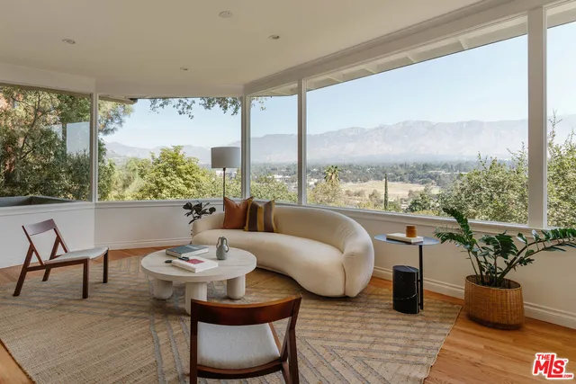 a view of a dining room with furniture window and outside view