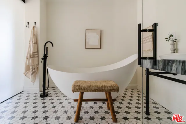a view of a chair and fire pit in backyard of the house