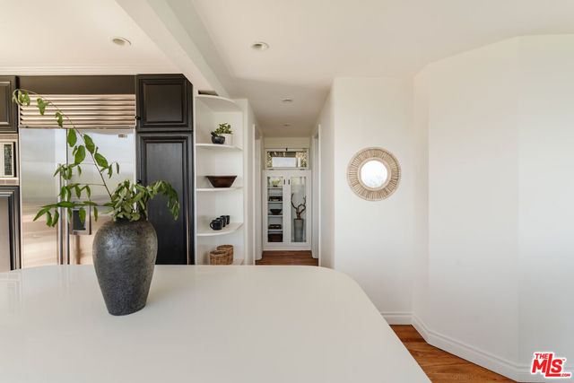 a view of a chair and fire pit in the backyard of a house