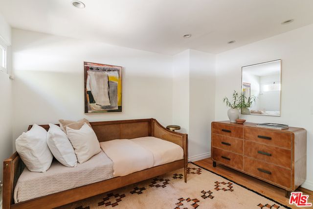 a view of balcony with chairs and wooden fence