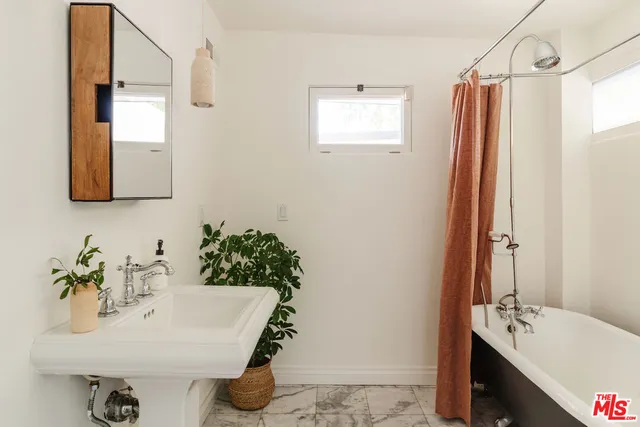 a view of a balcony with chairs and a table