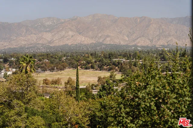 a view of a town with mountains in the background