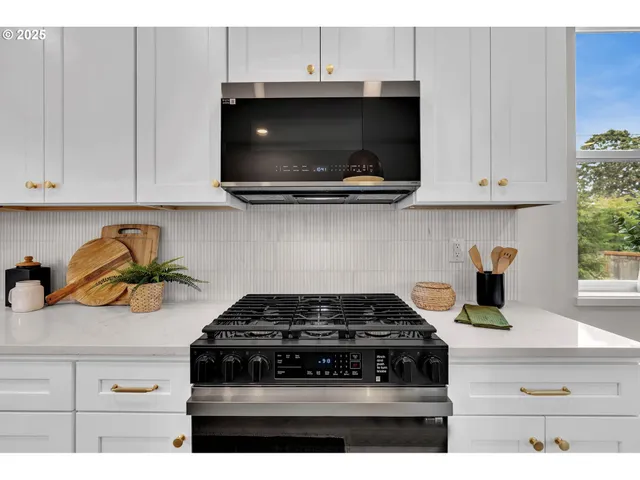 a kitchen with a stove and a microwave