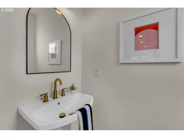 a bathroom with a sink mirror and vanity
