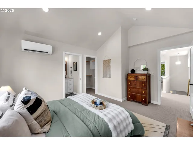 a bedroom with a bed and a couch