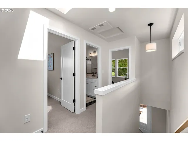 a view of an entryway with wooden floor