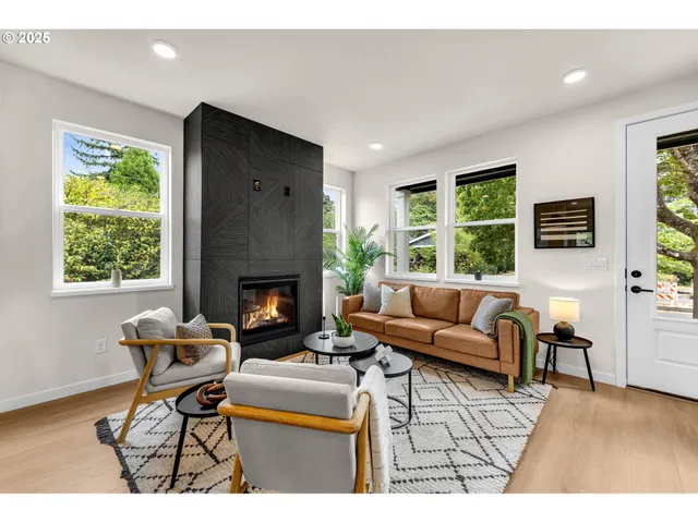 a living room with furniture and a fireplace