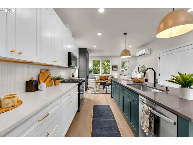 a kitchen with sink and cabinets