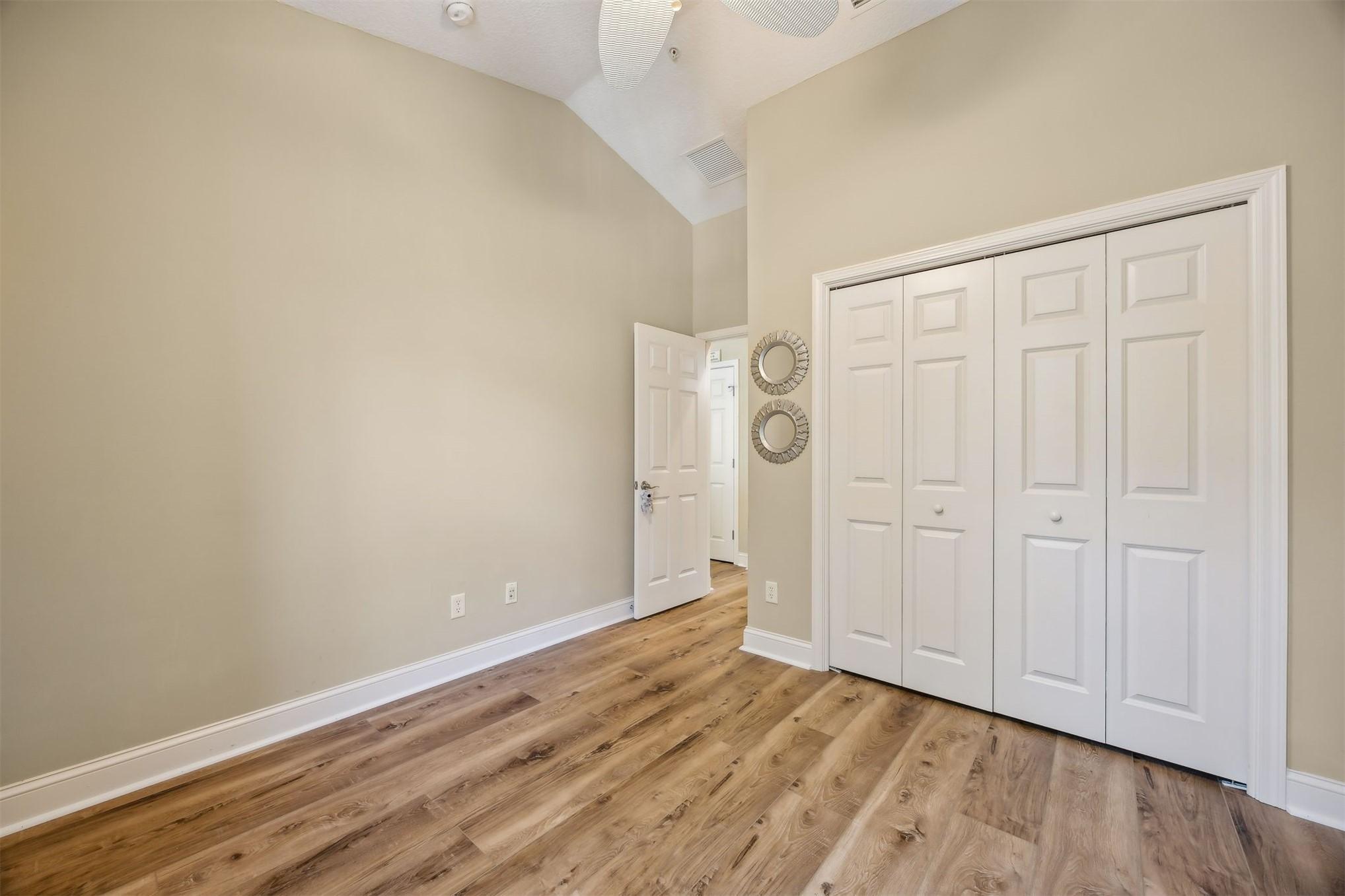 1839 Perimeter Park Road West, Unit 210 Fernandina Beach, FL 32034 - Photo 22 of 37 a view of an empty room with wooden floor
