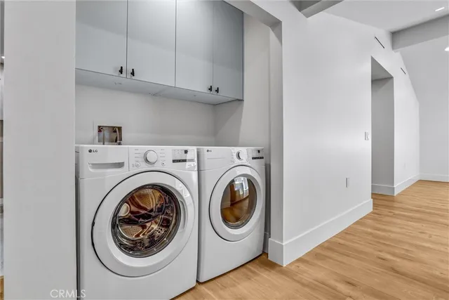 a kitchen with stainless steel appliances a refrigerator and cabinets