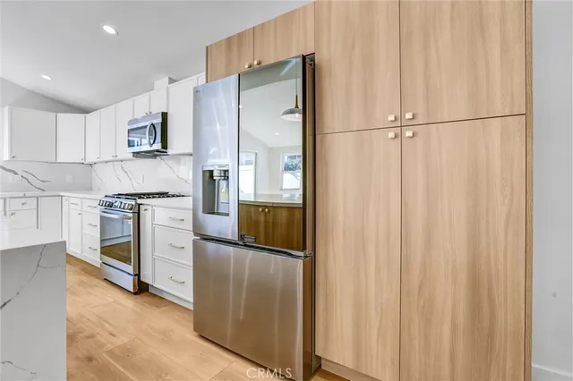 a kitchen with appliances cabinets and a counter top