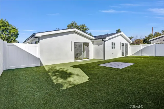 a view of a back yard of the house