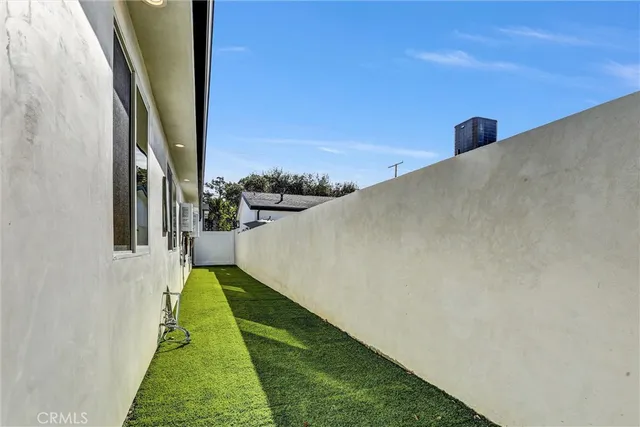 a kitchen with stainless steel appliances a refrigerator sink and microwave