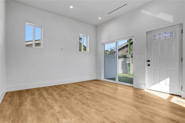 a view of a hallway with washer and dryer