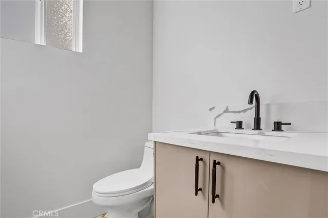 a kitchen with a stove and a microwave